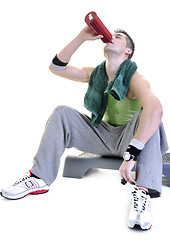 Image showing sportsman relaxing and drinking water