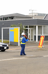 Image showing Man directing traffic 2