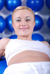 Image showing young woman exercising with pilates ball