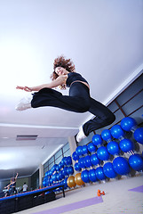 Image showing Dancing woman, happy and jumping up.