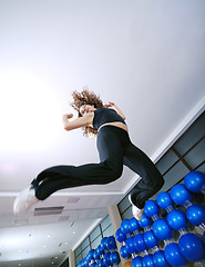 Image showing Dancing woman, happy and jumping up.