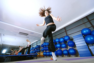 Image showing Dancing woman, happy and jumping up.