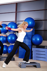 Image showing woman stepping in a fitness center