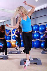 Image showing woman stepping in a fitness center