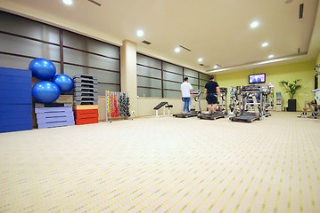 Image showing Man running on treadmill in gym