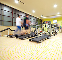 Image showing Man running on treadmill in gym