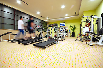 Image showing Man running on treadmill in gym