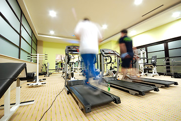 Image showing Man running on treadmill in gym