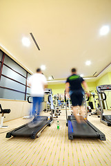 Image showing Man running on treadmill in gym