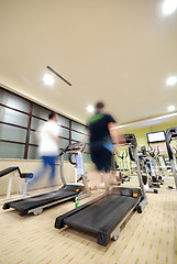 Image showing Man running on treadmill in gym