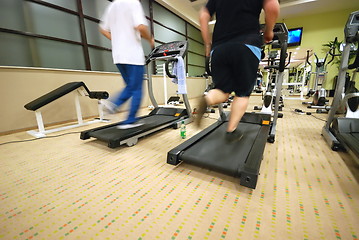 Image showing Man running on treadmill in gym