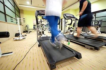 Image showing Man running on treadmill in gym