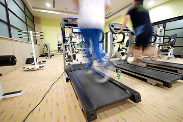 Image showing Man running on treadmill in gym