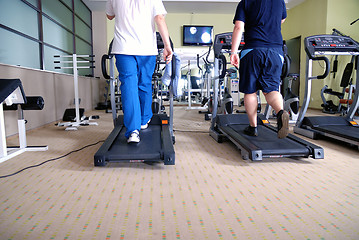 Image showing Man running on treadmill in gym