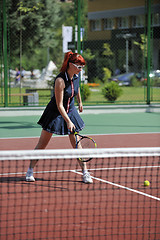 Image showing young woman play tennis game outdoor