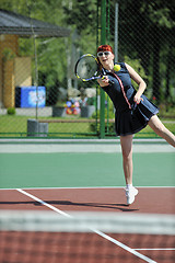 Image showing young woman play tennis game outdoor