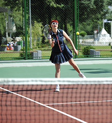 Image showing young woman play tennis game outdoor