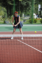 Image showing young woman play tennis game outdoor