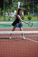 Image showing young woman play tennis game outdoor