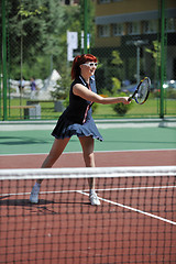 Image showing young woman play tennis game outdoor