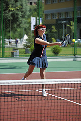 Image showing young woman play tennis game outdoor