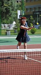 Image showing young woman play tennis game outdoor