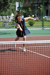 Image showing young woman play tennis game outdoor