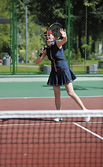 Image showing young woman play tennis game outdoor