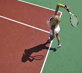 Image showing young woman play tennis game outdoor