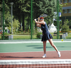 Image showing young woman play tennis game outdoor