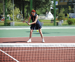 Image showing young woman play tennis game outdoor