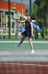 Image showing young woman play tennis game outdoor