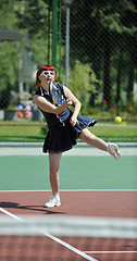 Image showing young woman play tennis game outdoor