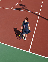 Image showing young woman play tennis game outdoor