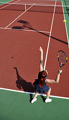 Image showing young woman play tennis game outdoor