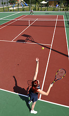 Image showing young woman play tennis game outdoor