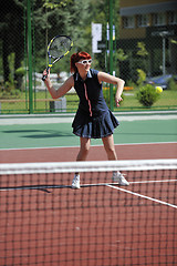 Image showing young woman play tennis game outdoor