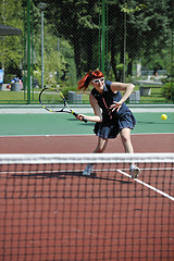 Image showing young woman play tennis game outdoor
