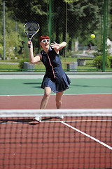 Image showing young woman play tennis game outdoor