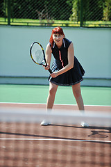 Image showing young woman play tennis game outdoor