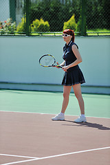 Image showing young woman play tennis game outdoor