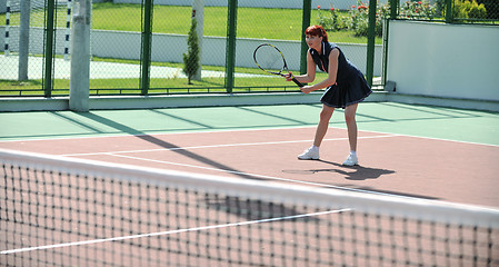 Image showing young woman play tennis game outdoor