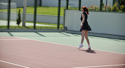 Image showing young woman play tennis game outdoor