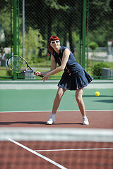 Image showing young woman play tennis game outdoor