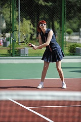 Image showing young woman play tennis game outdoor