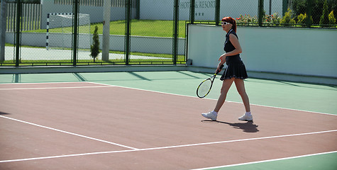 Image showing young woman play tennis game outdoor