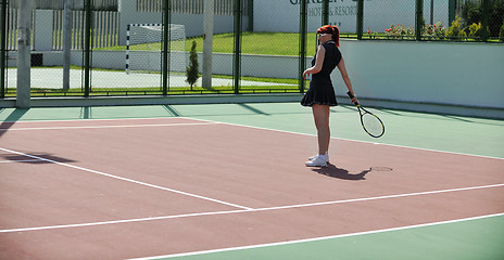 Image showing young woman play tennis game outdoor