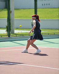 Image showing young woman play tennis game outdoor