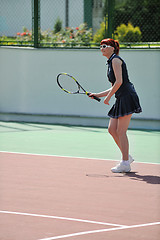 Image showing young woman play tennis game outdoor