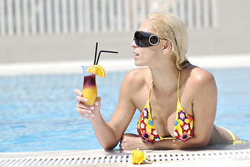 Image showing beautiful woman relax on swimming pool